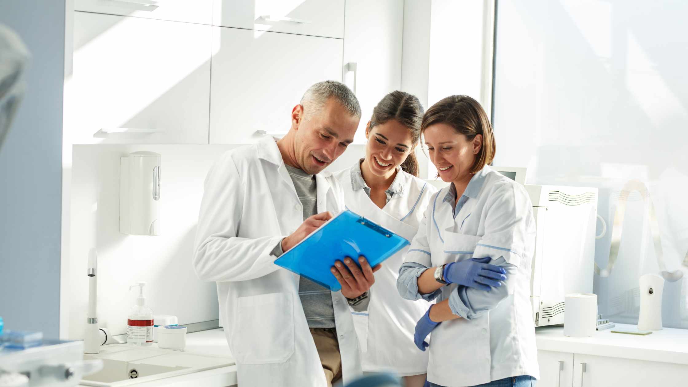 Group of dentists collaborating with growth chart overlay